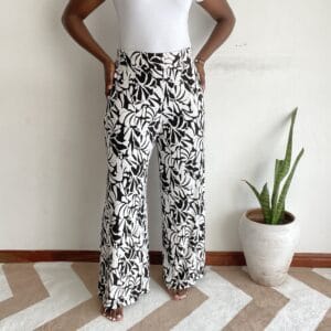 Black background cream abstract floral wide-leg pants, front view
