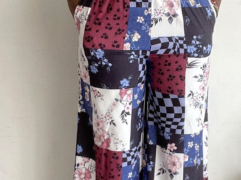 Floral checkerboard patchwork wide-leg pants, close up