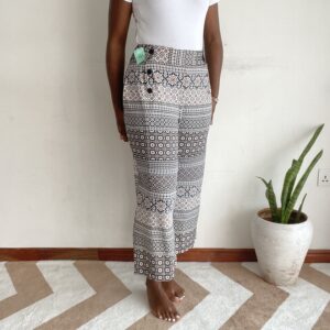 Black white and red moroccan mosaic print button-waist pants, front view